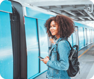 women in front of train