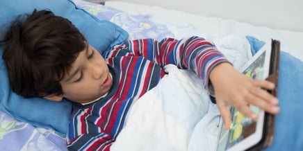 Child patient in hospital bed using tablet-951825-edited